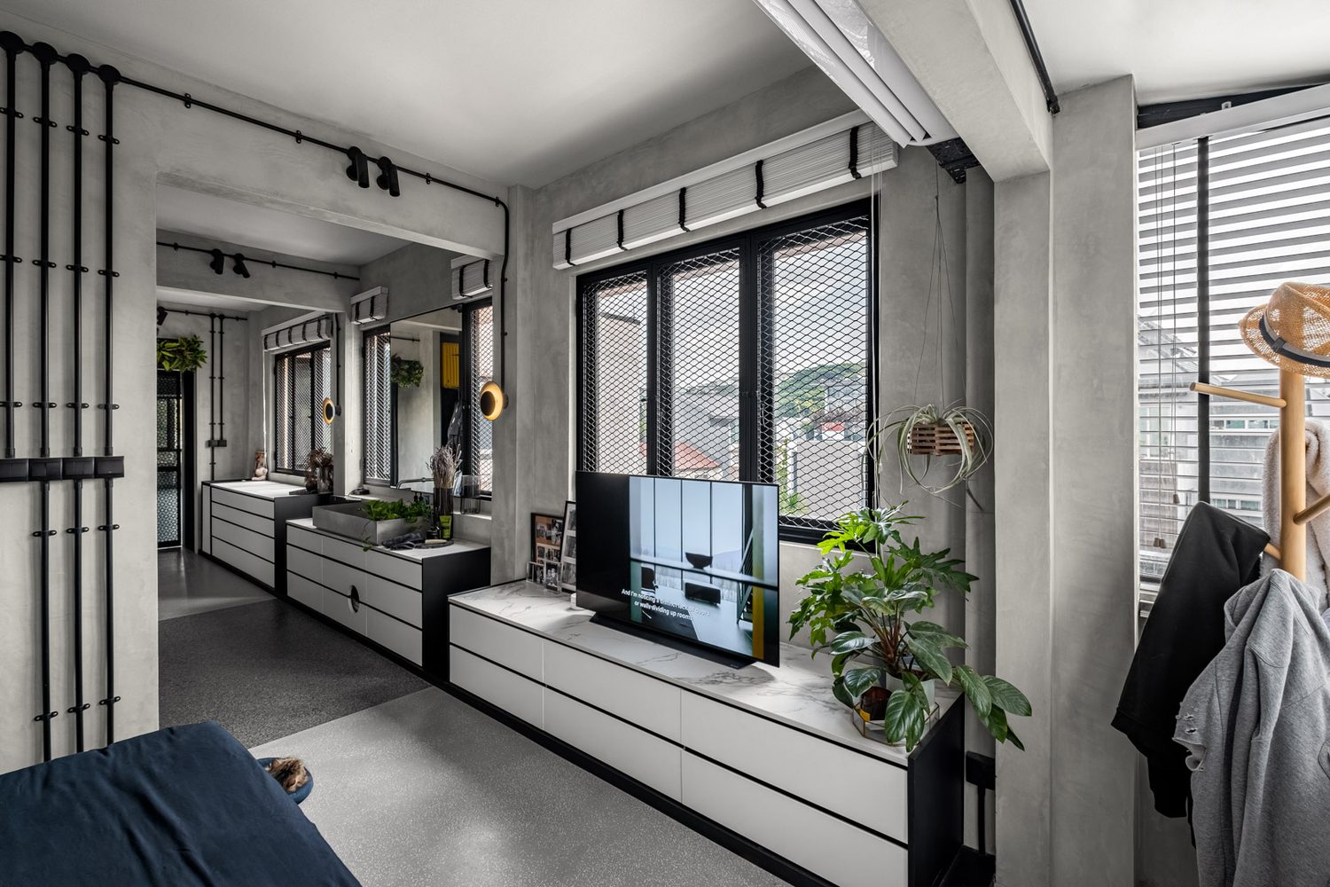 The dressing corridor — white drawers and a marble top running to the window